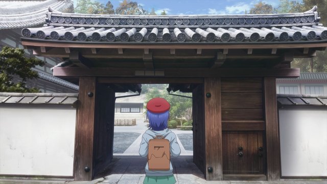 Pausing at an Ancient Temple Gate